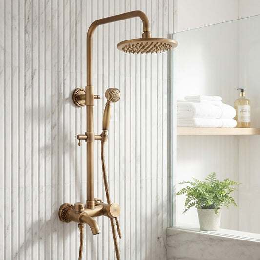 Lagomel wall-mounted tub and shower system in antique brass, set in a Vintage/Retro bathroom