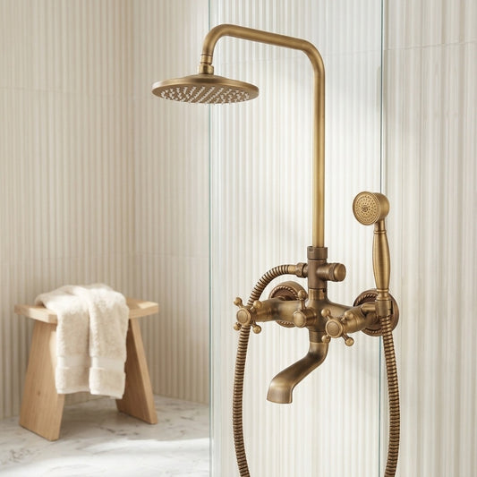 Lagomel wall-mounted waterfall tub and shower system in antique brass, brushed nickel, set in a Traditional/Classic bathroom