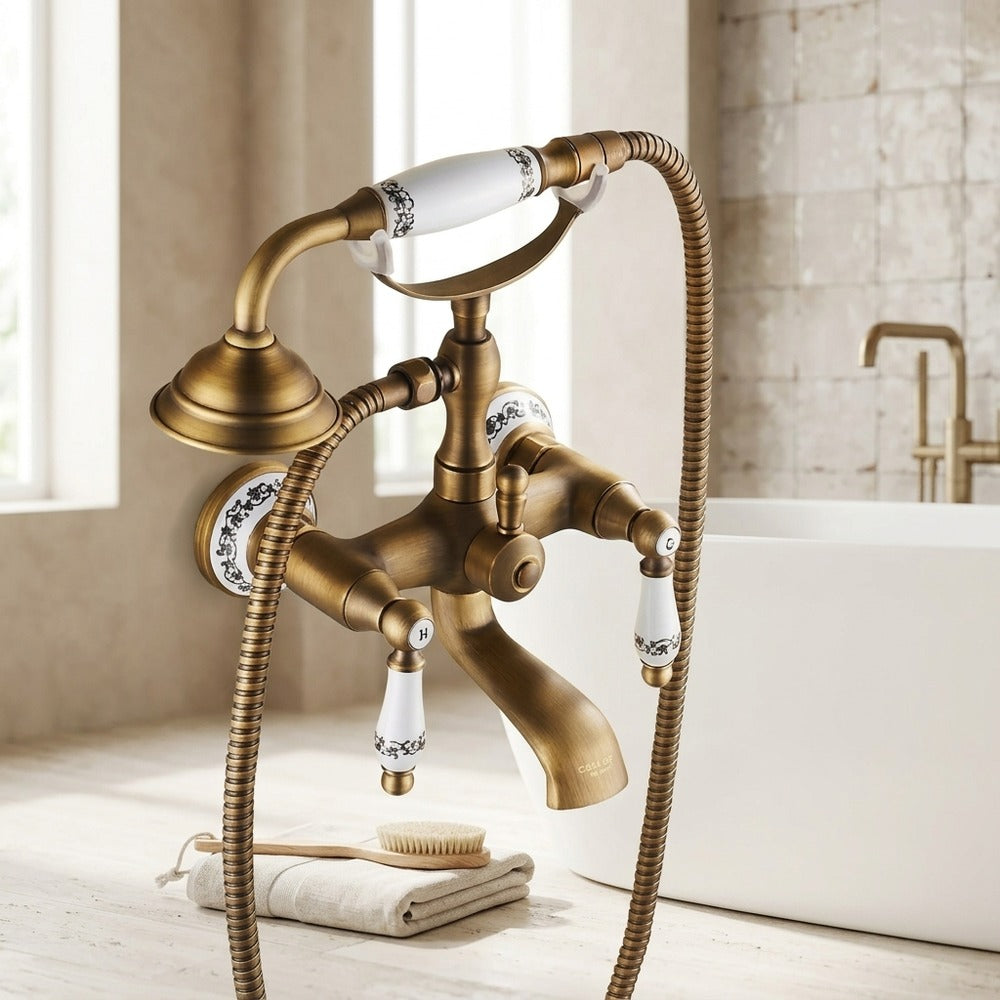 Lagomel wall-mount tub filler in antique brass, two-tone / mixed finish, set in a Traditional/Classic/Vintage/Retro bathroom