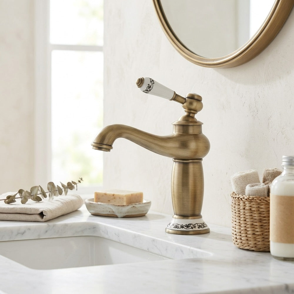 Lagomel single-hole bathroom faucet in antique brass, chrome, matte black, polished gold, two-tone / mixed finish, set in a Traditional/Classic/Vintage/Retro bathroom