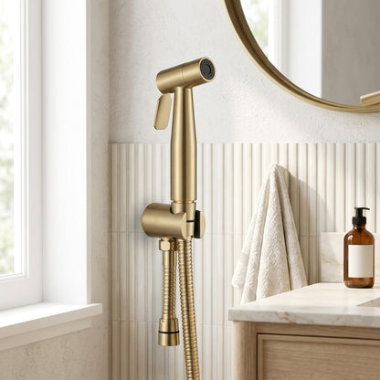 Lagomel bidet faucet in brushed gold, set in a Contemporary bathroom