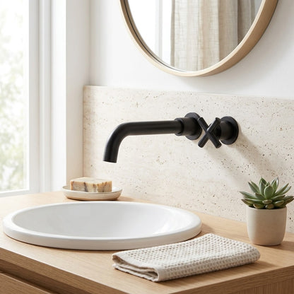 Lagomel single-hole wall-mount bathroom faucet in matte black, set in a Contemporary bathroom