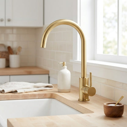 Lagomel single-handle kitchen faucet in brushed gold, set in a Contemporary/Modern kitchen