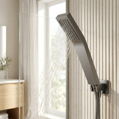 Lagomel wall-mounted hand shower in matte black, set in a Contemporary bathroom