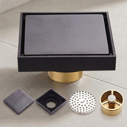 Lagomel square floor drain in oil-rubbed bronze, set in a Modern bathroom