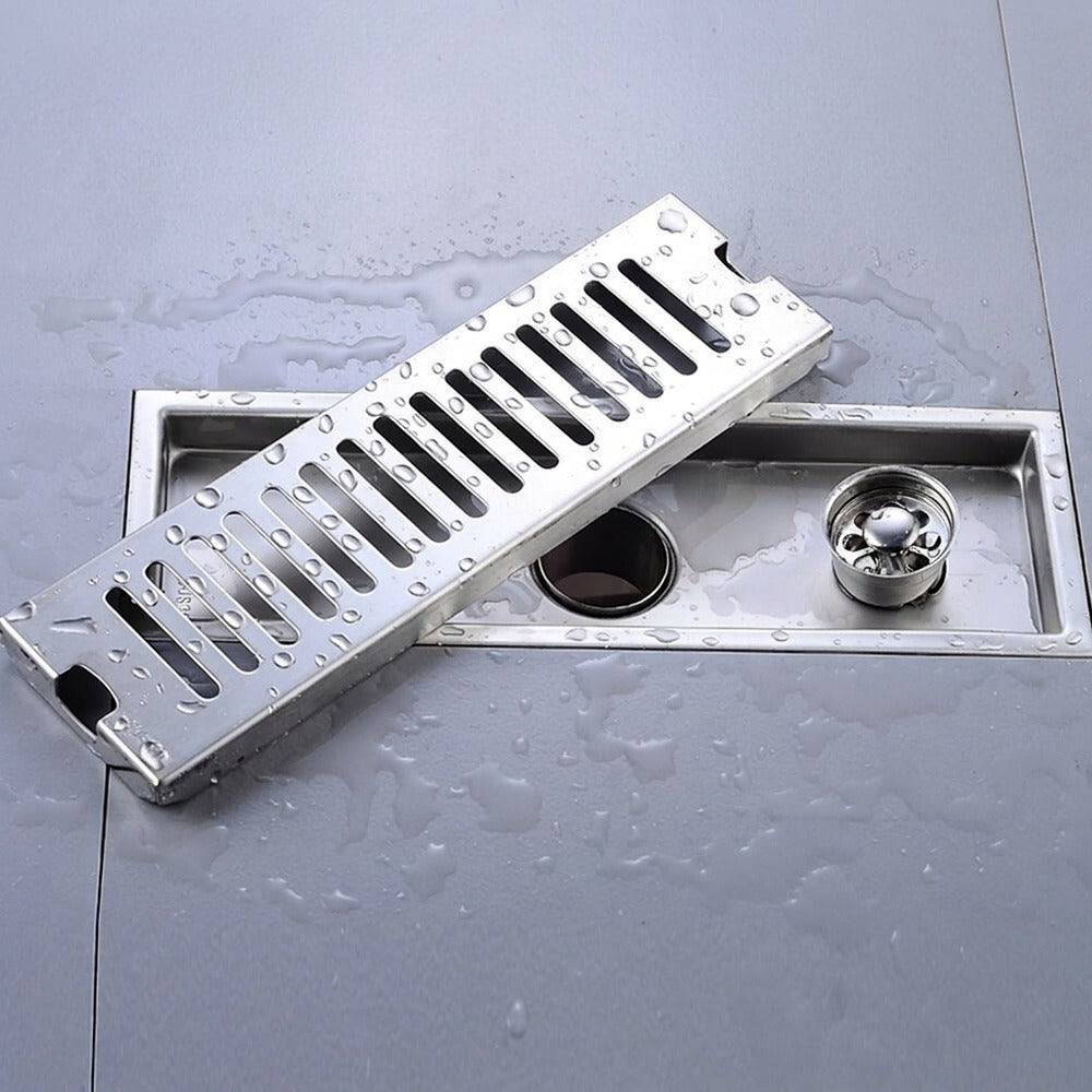 Lagomel linear floor drain in stainless steel, set in a Modern bathroom