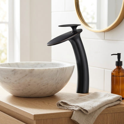 Lagomel single-hole waterfall vessel sink faucet, set in a Modern/Contemporary bathroom