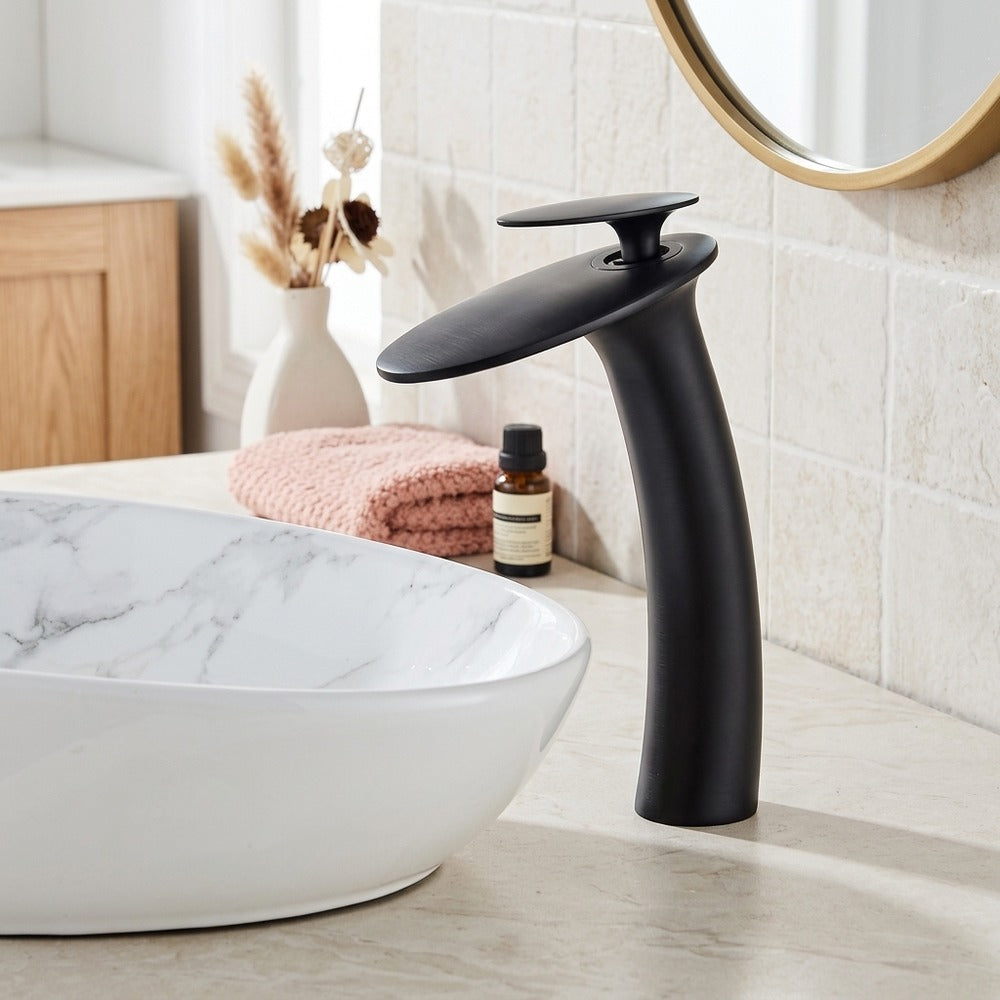 Lagomel single-hole waterfall vessel sink faucet, set in a Modern/Contemporary bathroom