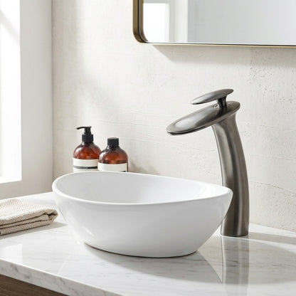 Lagomel single-hole waterfall vessel sink faucet, set in a Modern/Contemporary bathroom