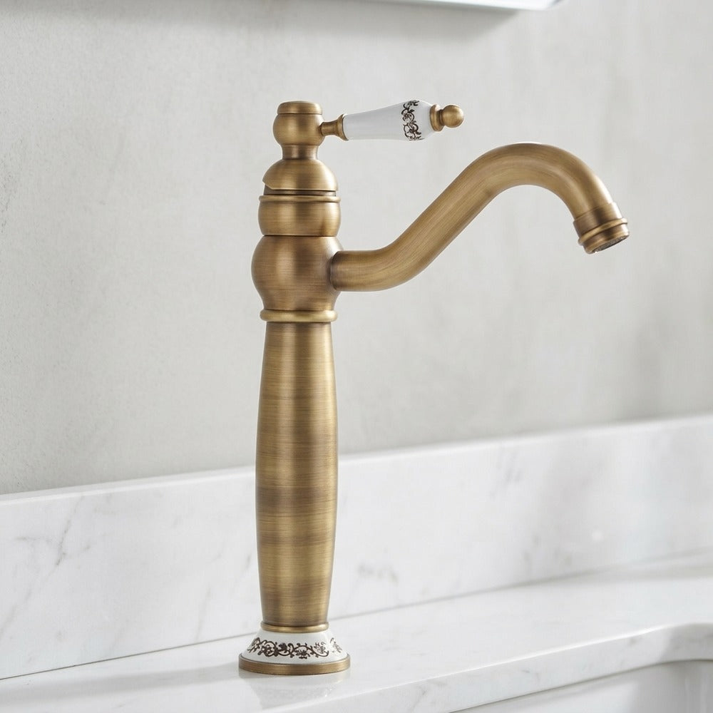 Lagomel single-handle vessel sink faucet in antique brass, matte black, set in a Vintage/Retro/Contemporary bathroom