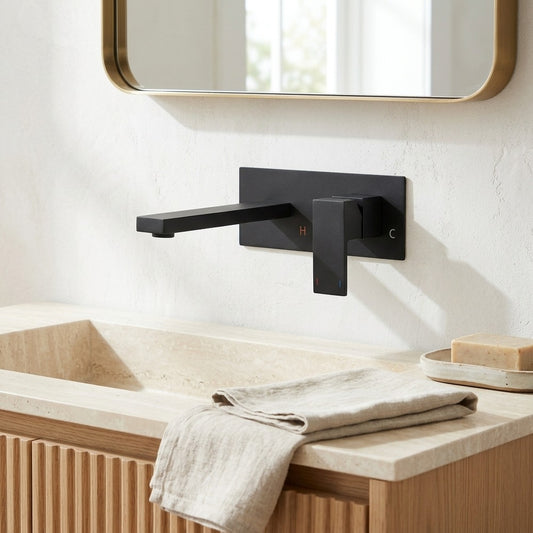 Lagomel single-handle wall-mount bathroom faucet in matte black, set in a Contemporary bathroom