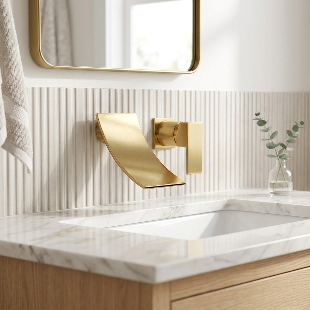 Lagomel waterfall single-handle wall-mount bathroom faucet in brushed gold, set in a Modern/Contemporary bathroom