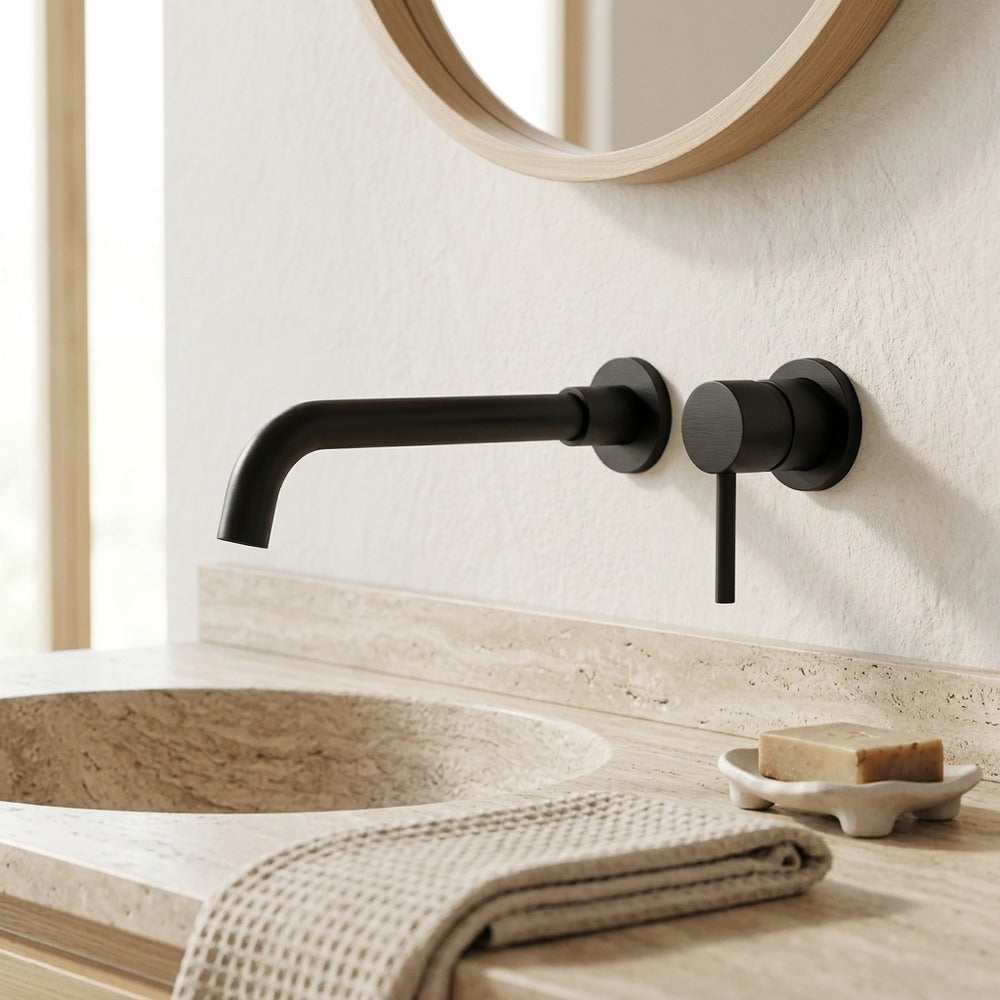 Lagomel single-handle wall-mount bathroom faucet in matte black, set in a Contemporary bathroom