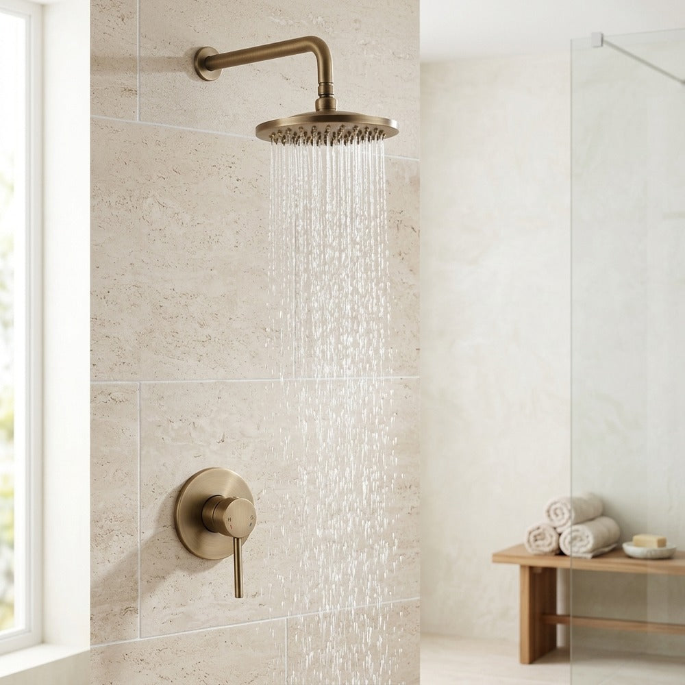 Lagomel wall-mounted single-handle complete shower system in antique brass, set in a Traditional/Classic bathroom