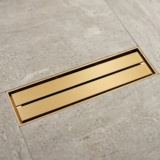 Lagomel linear floor drain in brushed gold, set in a Contemporary/Modern bathroom