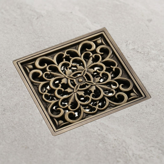 Lagomel square floor drain in antique brass, set in a Traditional/Classic bathroom