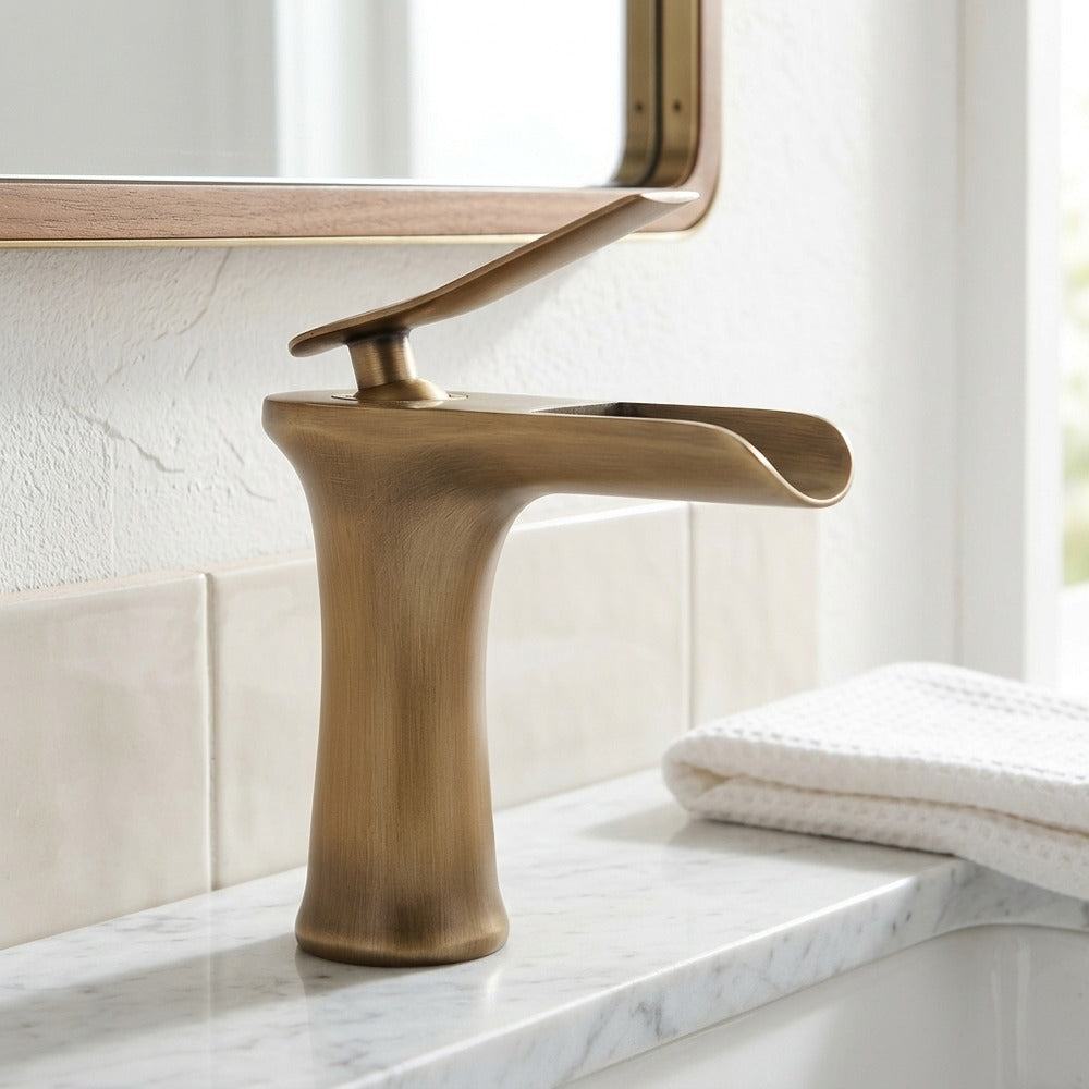 Lagomel single-hole waterfall faucet and drain set in antique bronze, set in a Modern/Contemporary bathroom