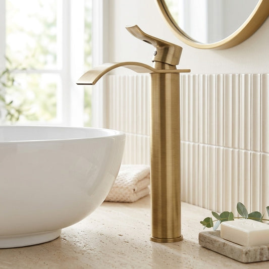Lagomel single-hole waterfall vessel sink faucet in antique brass, set in a Modern/Traditional/Classic bathroom