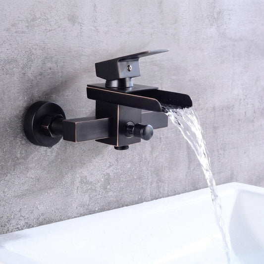 Lagomel waterfall single-handle wall-mount tub filler in oil-rubbed bronze, set in a Contemporary bathroom