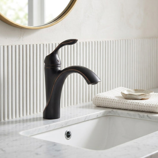 Lagomel single-hole bathroom faucet in oil-rubbed bronze, set in a Vintage/Retro/Contemporary bathroom
