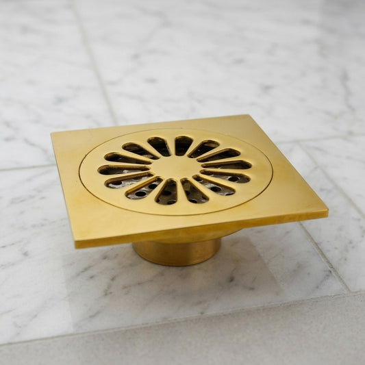 Lagomel square floor drain in polished brass, set in a Traditional/Classic bathroom