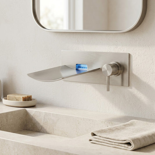 Lagomel waterfall single-handle wall-mount bathroom faucet in brushed nickel, set in a Contemporary bathroom