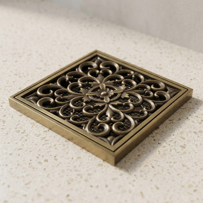 Lagomel square floor drain in antique brass, set in a Traditional/Classic bathroom