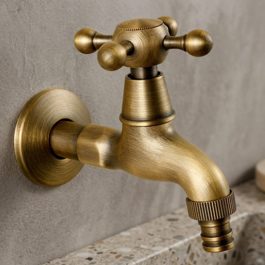 Lagomel wall-mounted single-handle washing machine faucet in antique brass, set in a Vintage/Retro bathroom