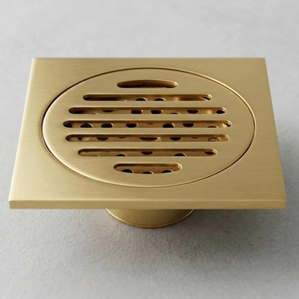 Lagomel square floor drain in polished brass, set in a Traditional/Classic bathroom