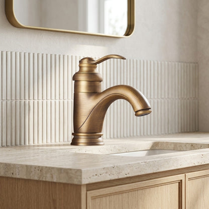 Lagomel single-hole bathroom faucet in antique brass, oil-rubbed bronze, polished gold, set in a Traditional/Classic bathroom
