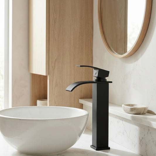 Lagomel single-hole waterfall vessel sink faucet in matte black, set in a Modern/Contemporary bathroom