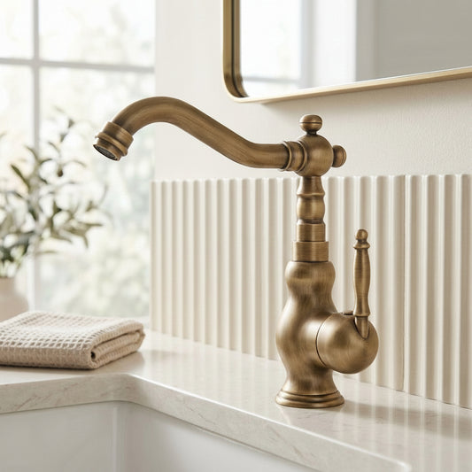 Lagomel single-hole bathroom faucet in antique brass, set in a Traditional/Classic/Vintage/Retro bathroom