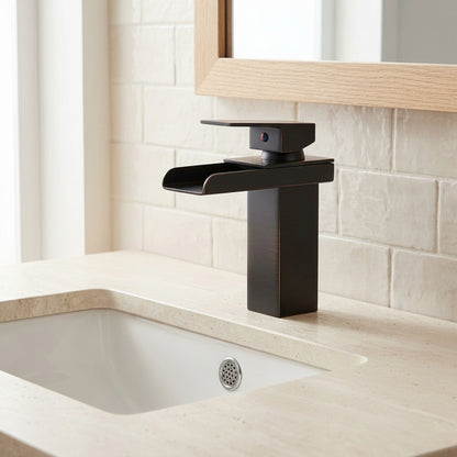 Lagomel waterfall single-hole bathroom faucet in matte black, set in a Modern/Contemporary bathroom