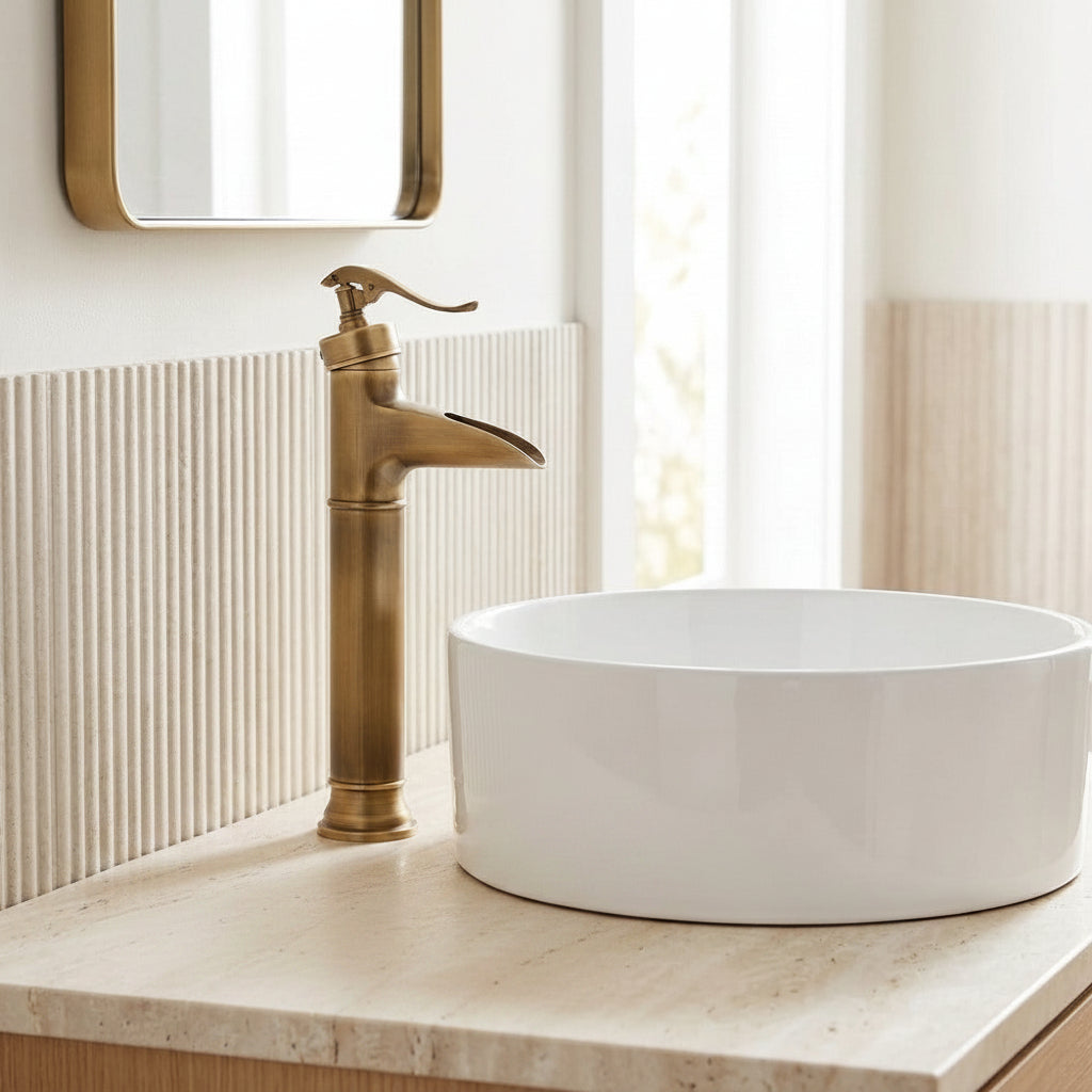 Lagomel waterfall single-handle vessel sink faucet in antique brass, set in a Traditional/Classic bathroom