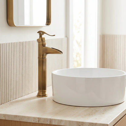 Lagomel waterfall single-handle vessel sink faucet in antique brass, set in a Traditional/Classic bathroom