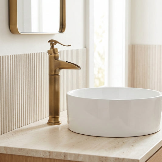 Lagomel waterfall single-handle vessel sink faucet in antique brass, set in a Traditional/Classic bathroom