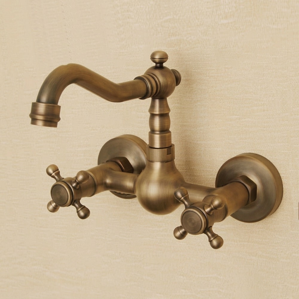 Lagomel wall-mount bathroom faucet in antique brass, set in a Traditional/Classic/Vintage/Retro bathroom