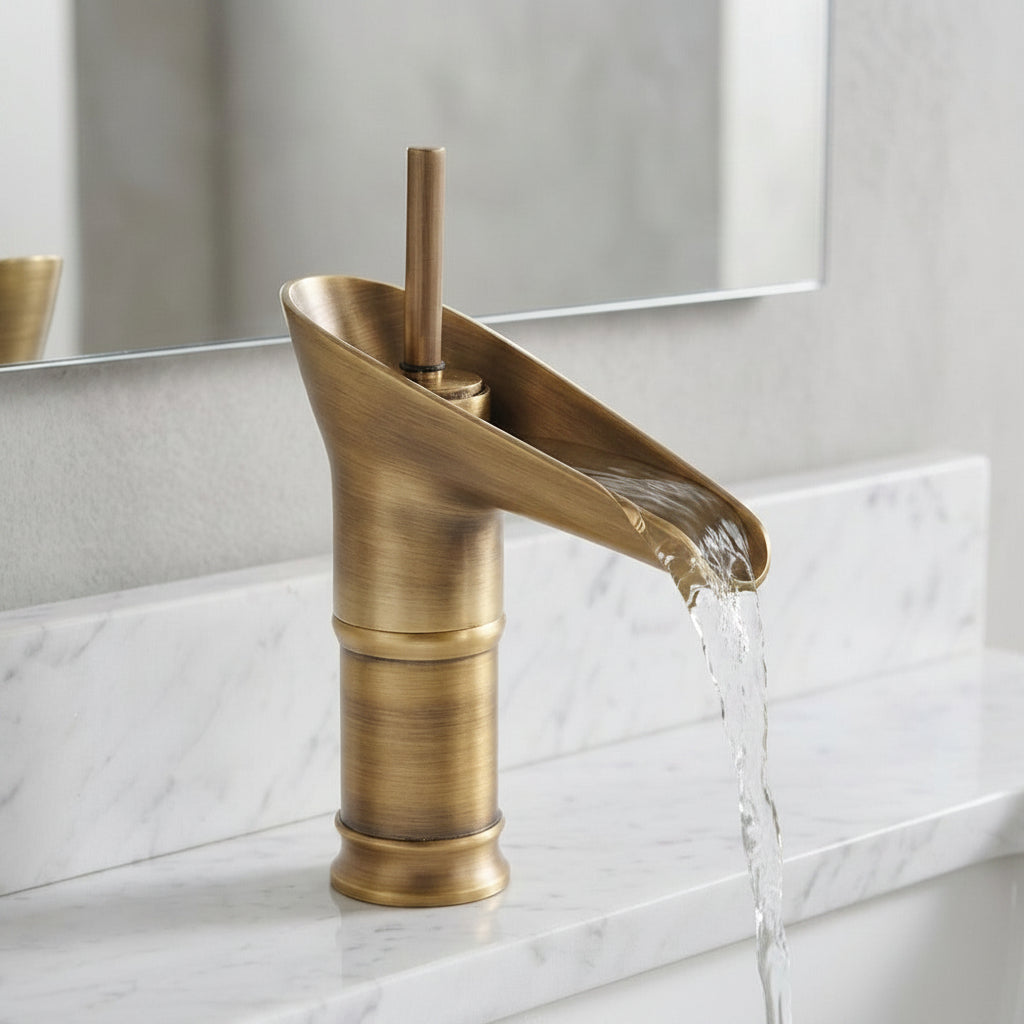 Lagomel waterfall single-hole bathroom faucet in antique brass, oil-rubbed bronze, polished gold, set in a Traditional/Classic/Modern bathroom