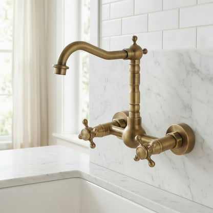 Lagomel wall-mount kitchen faucet in antique brass, set in a Traditional/Classic kitchen