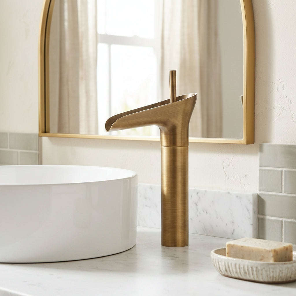 Lagomel single-hole waterfall vessel sink faucet in antique brass, brushed gold, oil-rubbed bronze, brushed nickel, chrome, set in a Modern bathroom