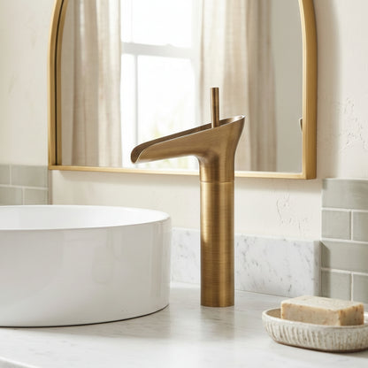 Lagomel single-hole waterfall vessel sink faucet in antique brass, brushed gold, oil-rubbed bronze, brushed nickel, chrome, set in a Modern bathroom