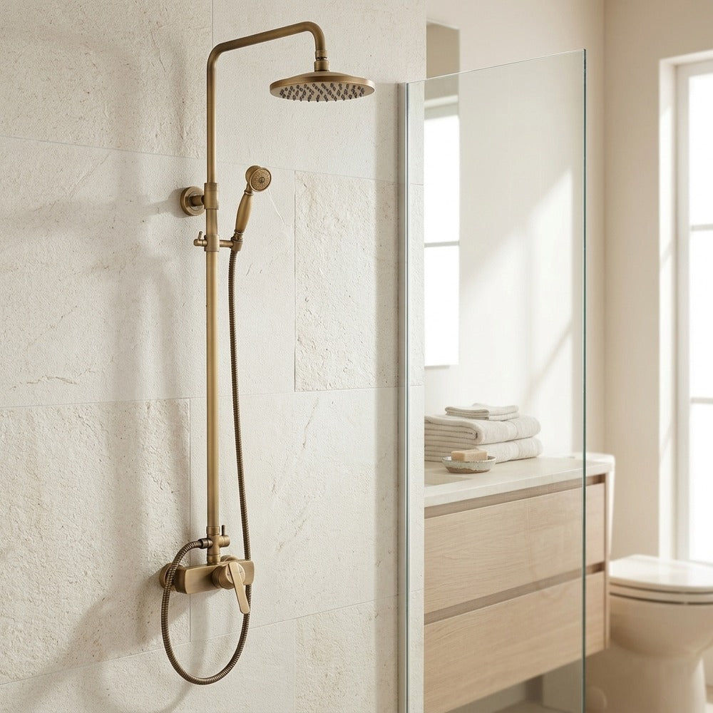 Lagomel wall-mounted single-handle complete shower system in antique brass, set in a Traditional/Classic bathroom