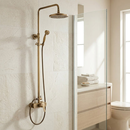 Lagomel wall-mounted single-handle complete shower system in antique brass, set in a Traditional/Classic bathroom