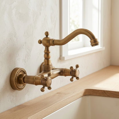 Lagomel wall-mount kitchen faucet in antique brass, set in a Traditional/Classic kitchen