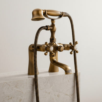 Lagomel two-handle deck-mount tub filler in antique brass, set in a Traditional/Classic bathroom