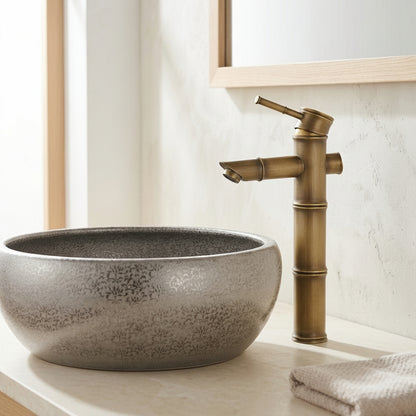 Lagomel single-hole single-handle vessel sink faucet, set in a Modern/Minimalist/Contemporary bathroom