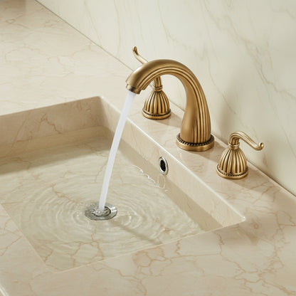 Gold faucet with water flowing into a sink in a bathroom setting.