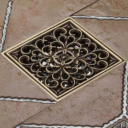 Lagomel square floor drain in antique brass, set in a Traditional/Classic bathroom