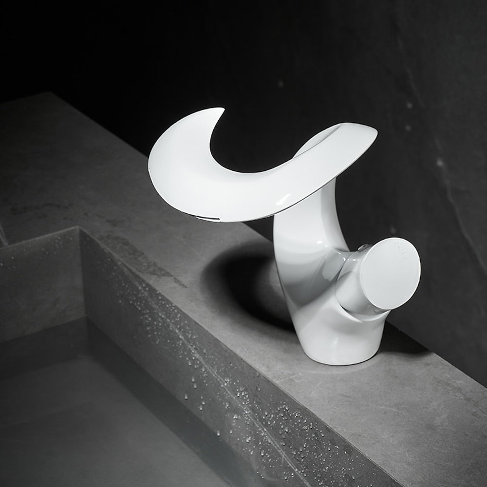 Lagomel waterfall single-hole bathroom faucet, set in a Modern/Minimalist bathroom