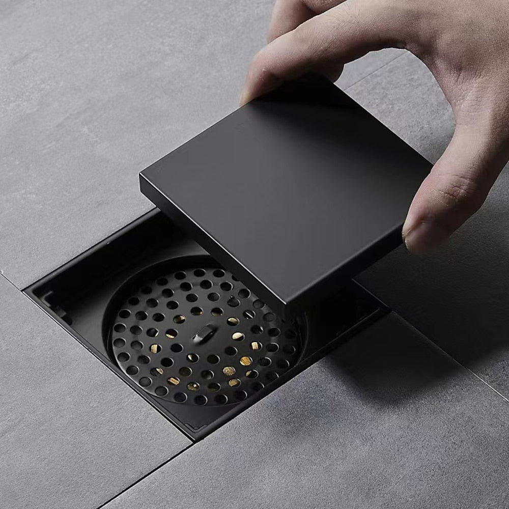 Lagomel square floor drain, set in a Contemporary bathroom